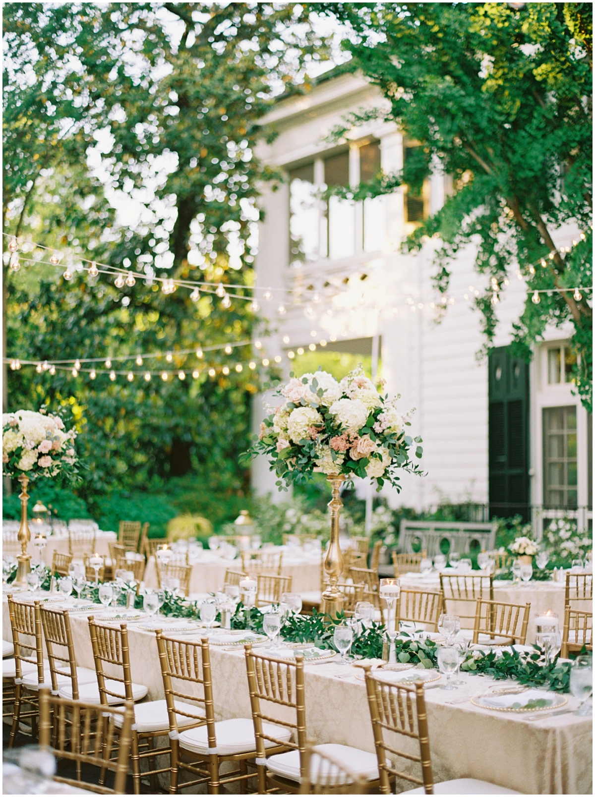 blush green and champagne spring wedding reception with bistro lights at Duke Mansion Charlotte NC 