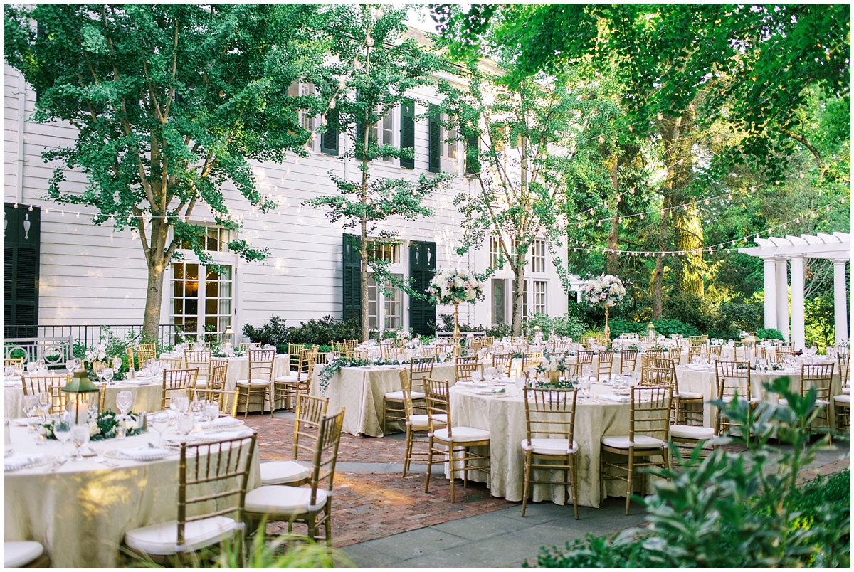 champagne blush and green table setting with bistro lights at Duke Mansion spring Wedding reception