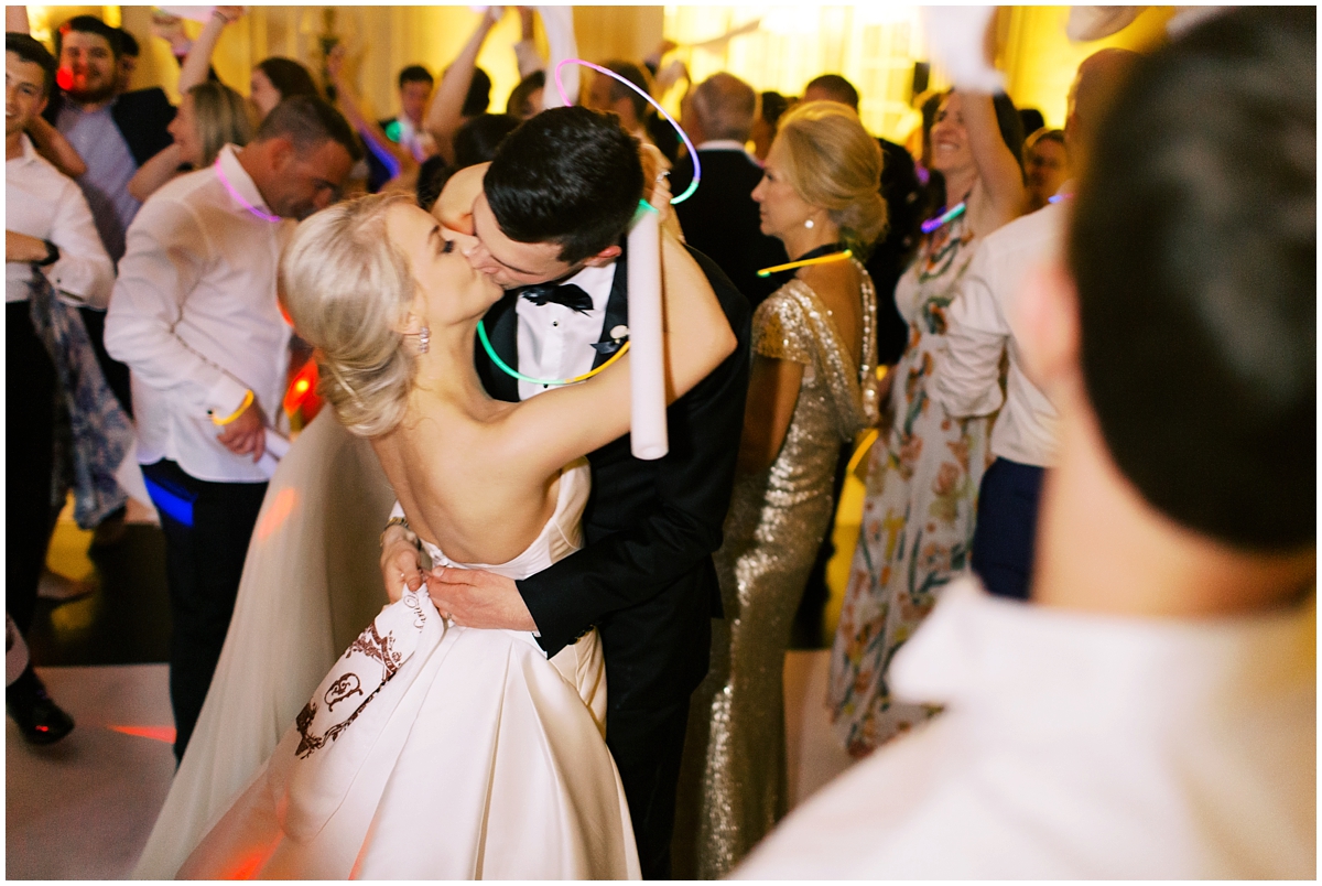 bride and groom kiss during reception at Duke Manion