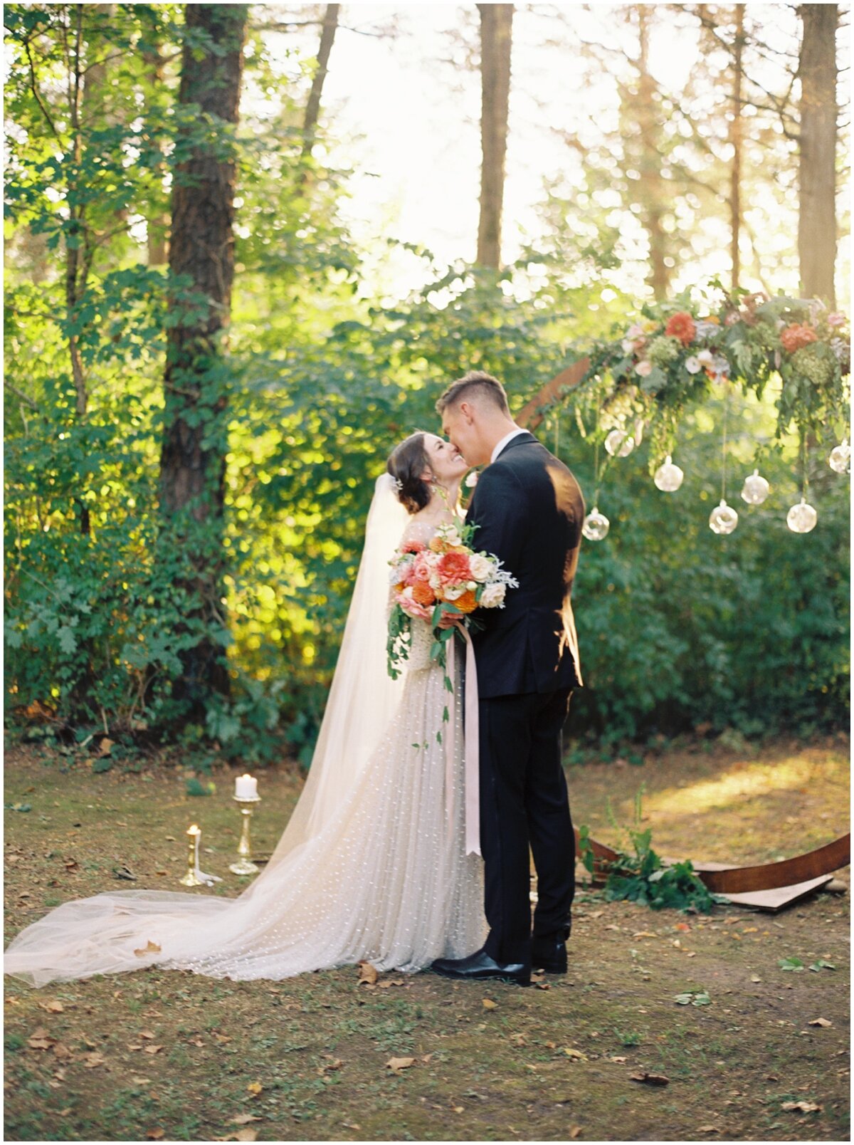 outdoor knoxville wedding ceremony in front of round arch and candles