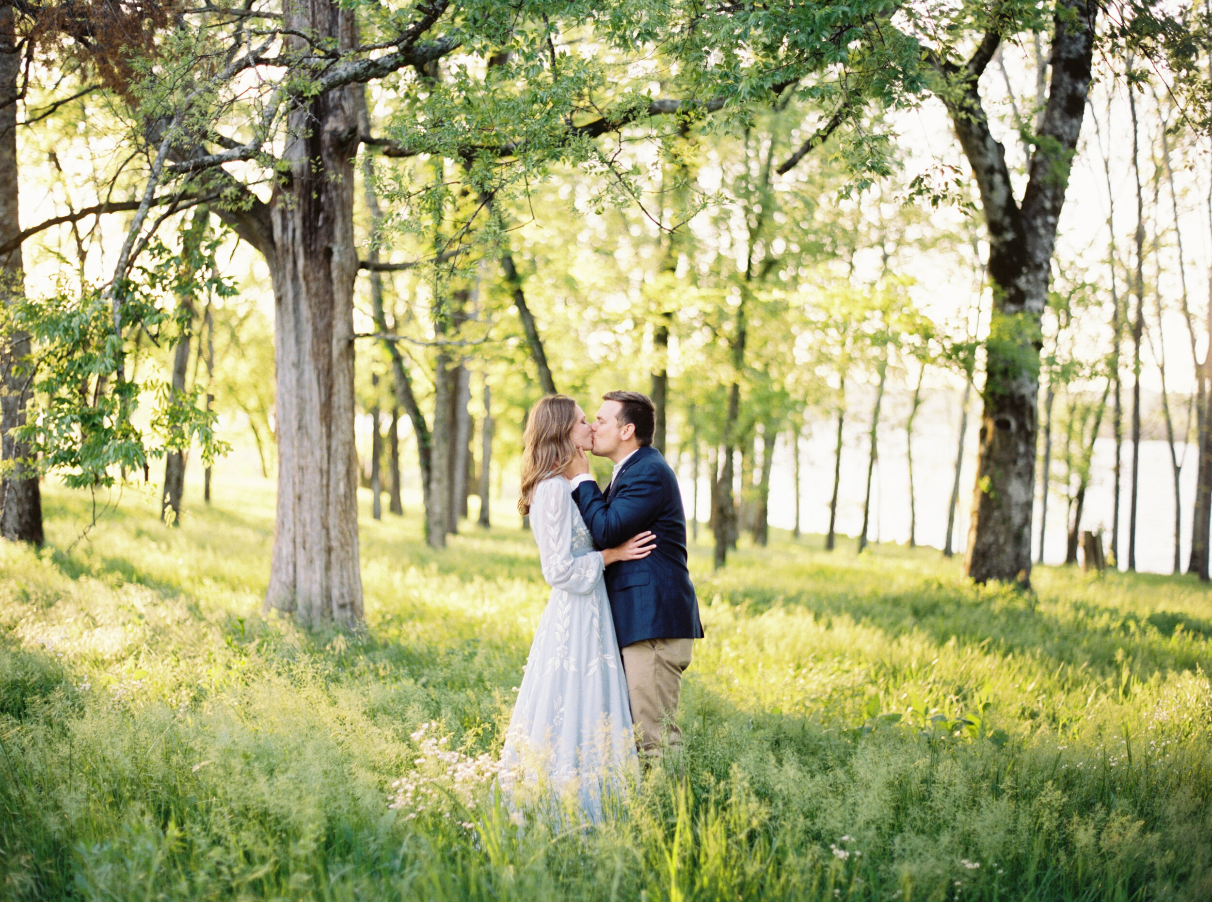 Couple kissing during engagement photos at marblegate farm in knoxville