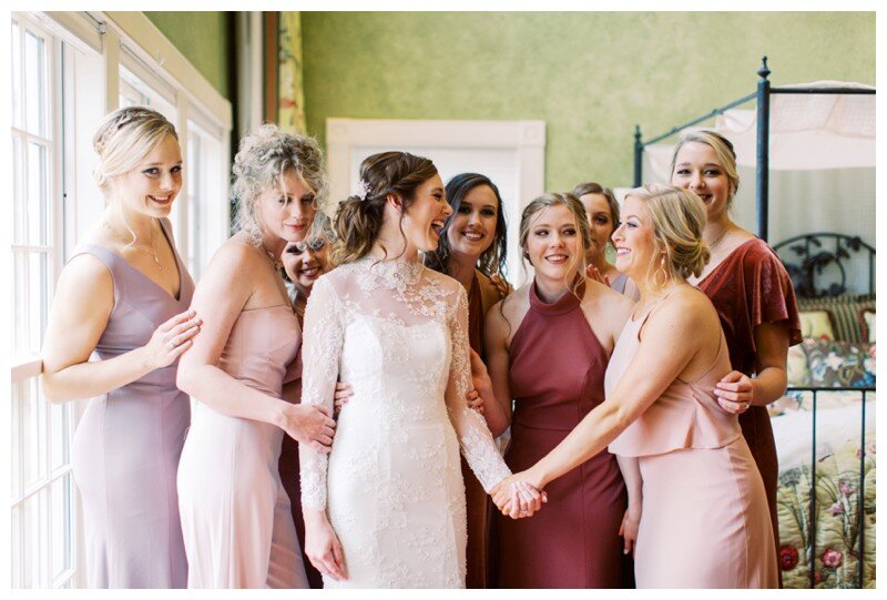 Bridal party mauve and crimson gowns for fall wedding