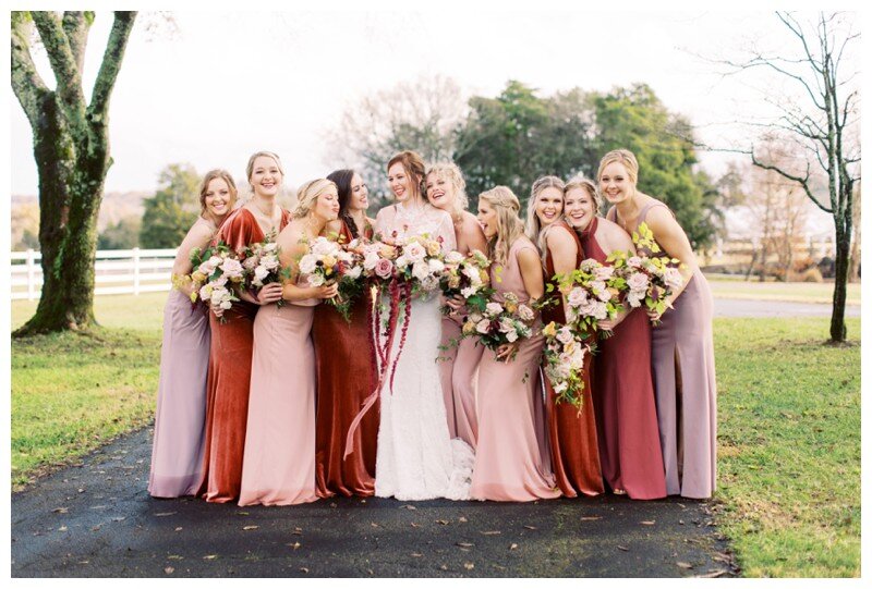 bridal party in mauve crimson ivory gowns 