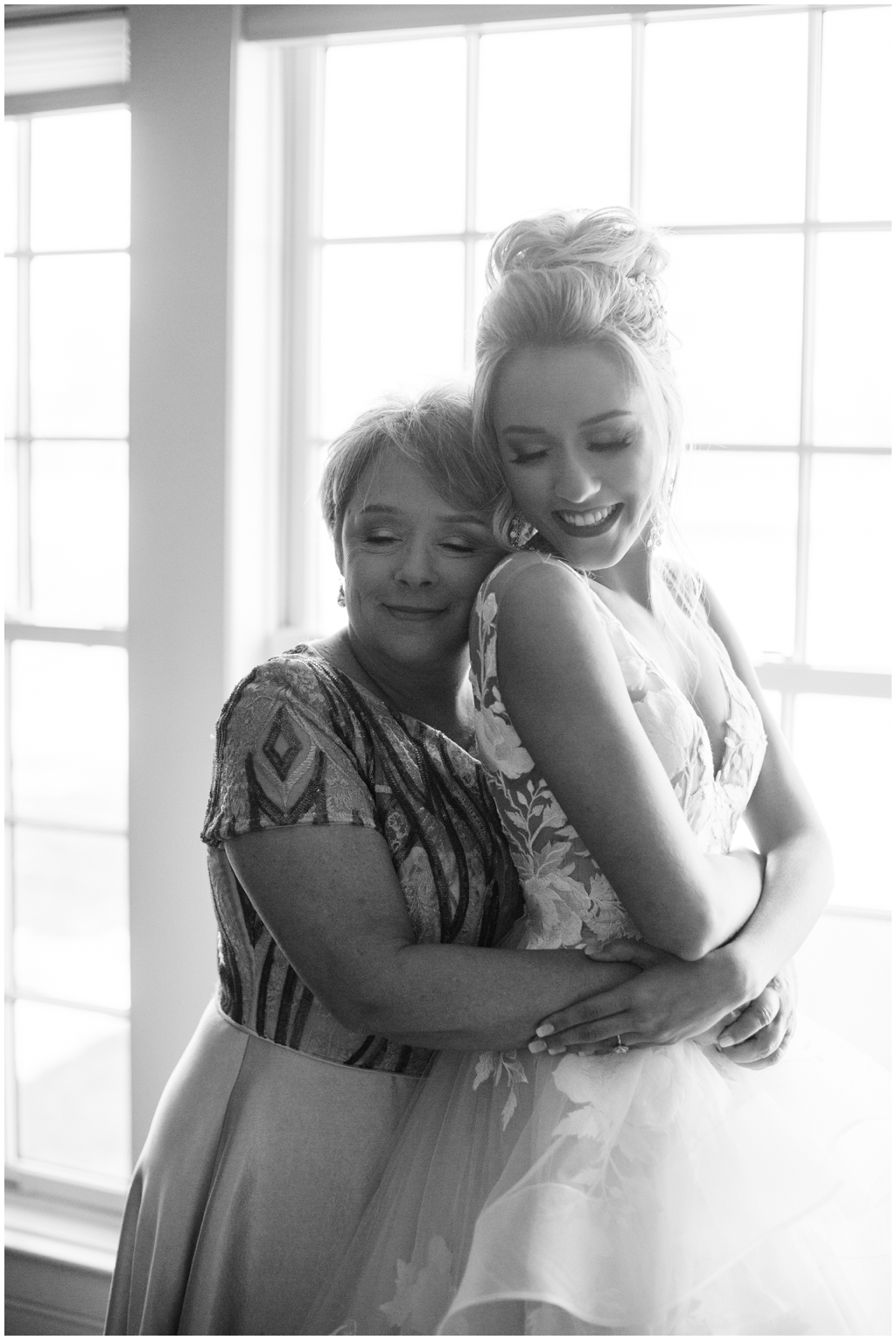 Emily Ann Roberts and mom share a hug after she gets into her wedding gown.