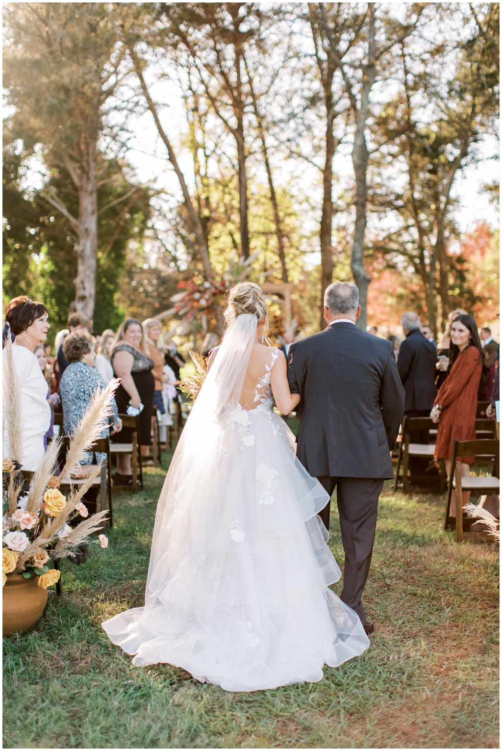 Emily Ann Roberts proceeds down the aisle at her fall Marblegate Farm wedding. 