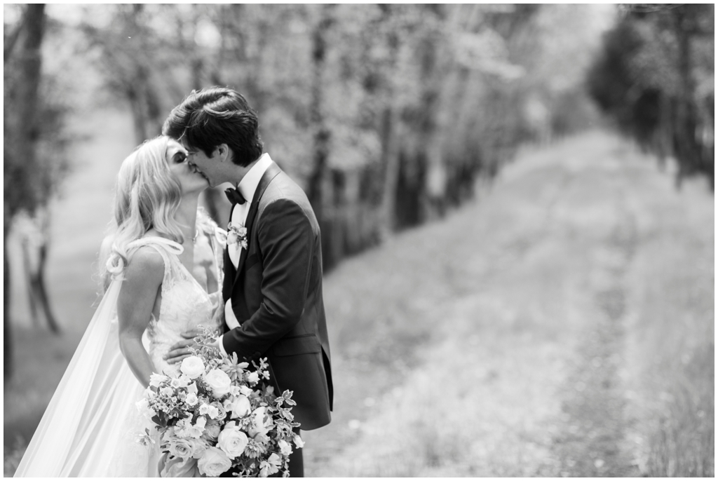 Classic black and white bride and groom kissing