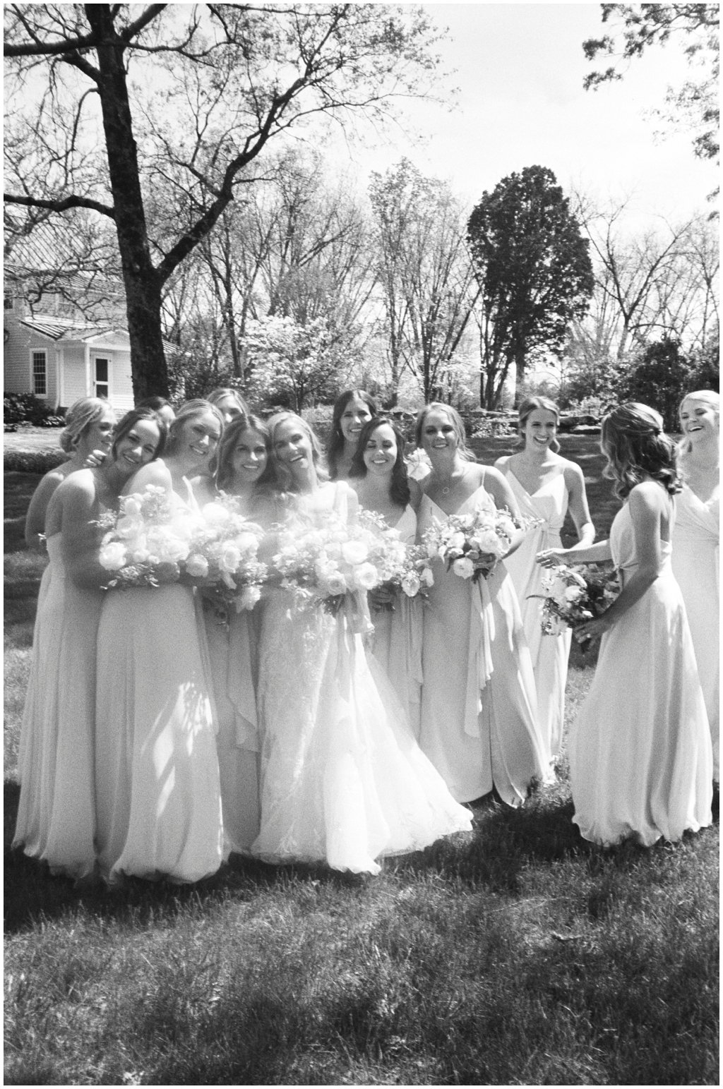 Film black and white photograph of bride and her bridesmaids