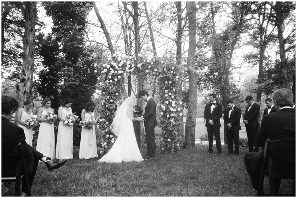 Black and white film image during the ceremony prayer